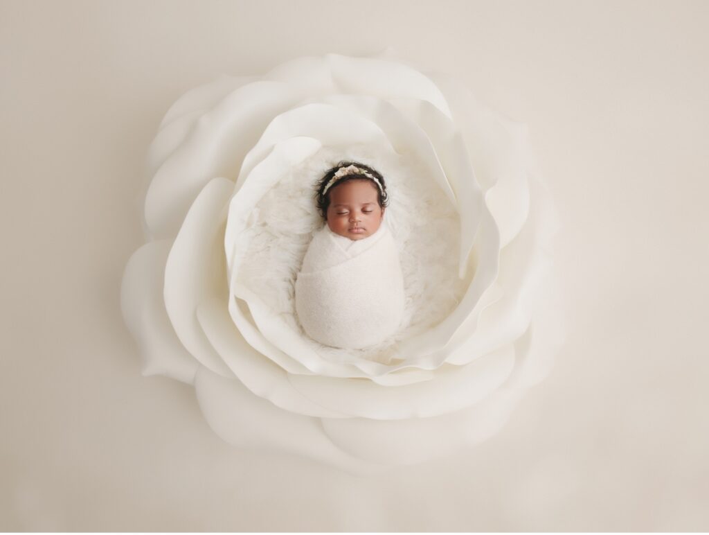 baby in flower bloom