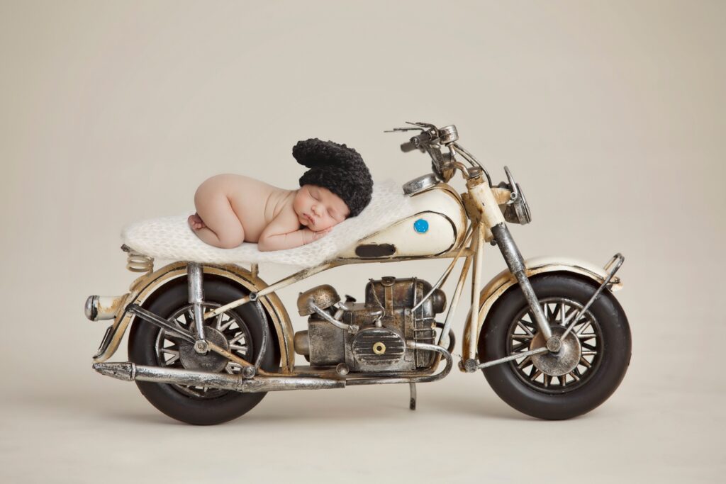 baby sleeping on motorcycle