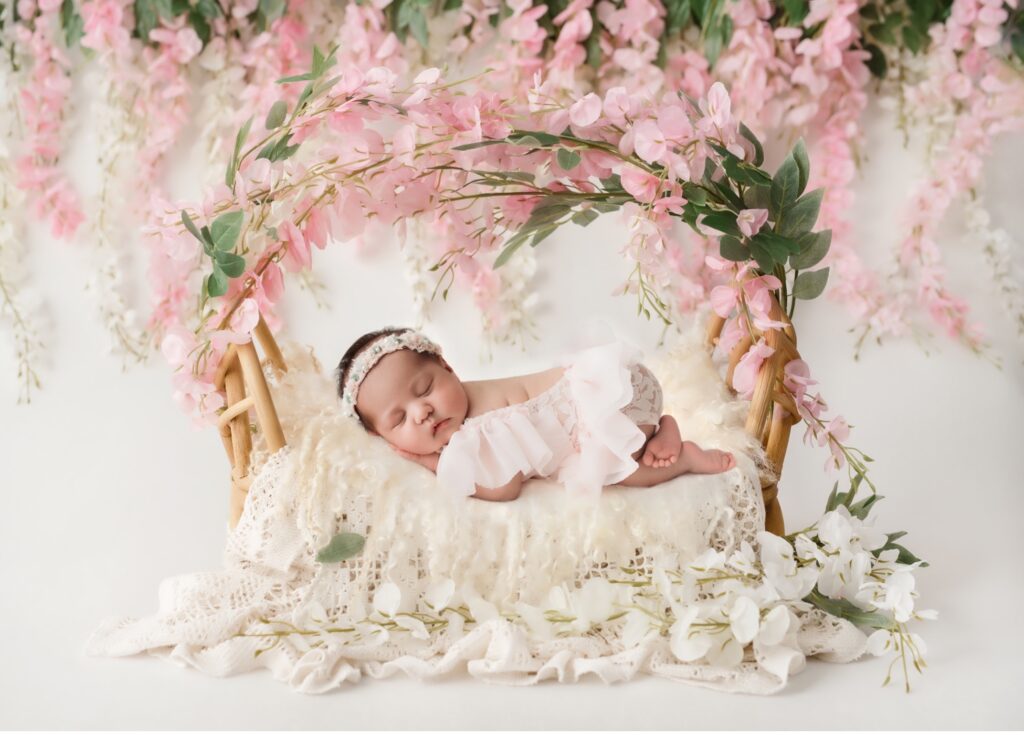 baby in floral bassinet