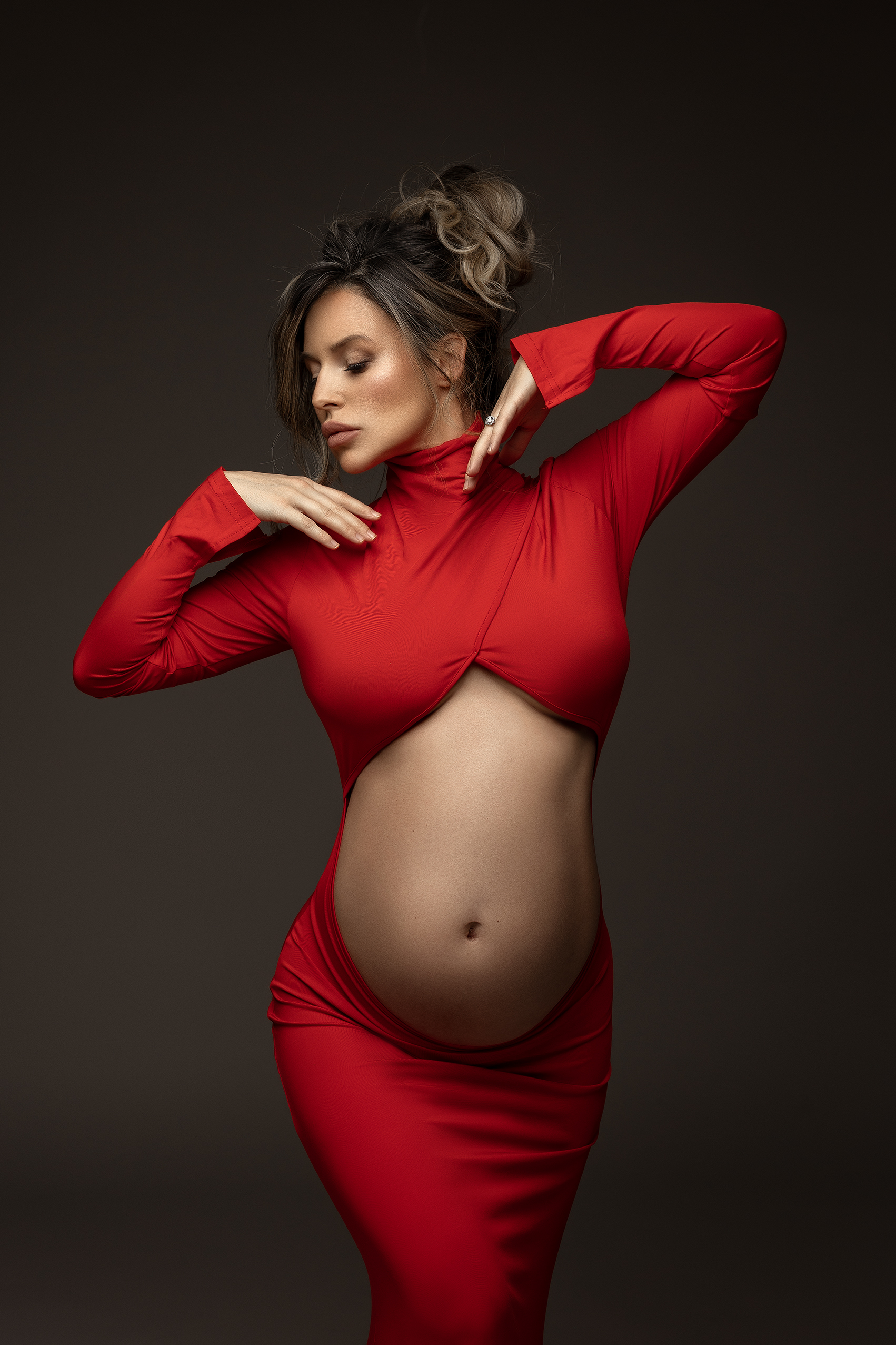 editorial maternity portrait in red dress, studio photography Toronto